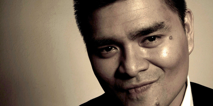 Sepia-tone photo of Jose Antonio Vargas grinning