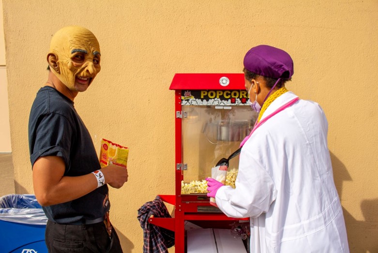 Passing out popcorn