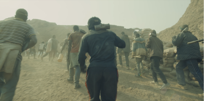 Medium shot of people walking up a hill