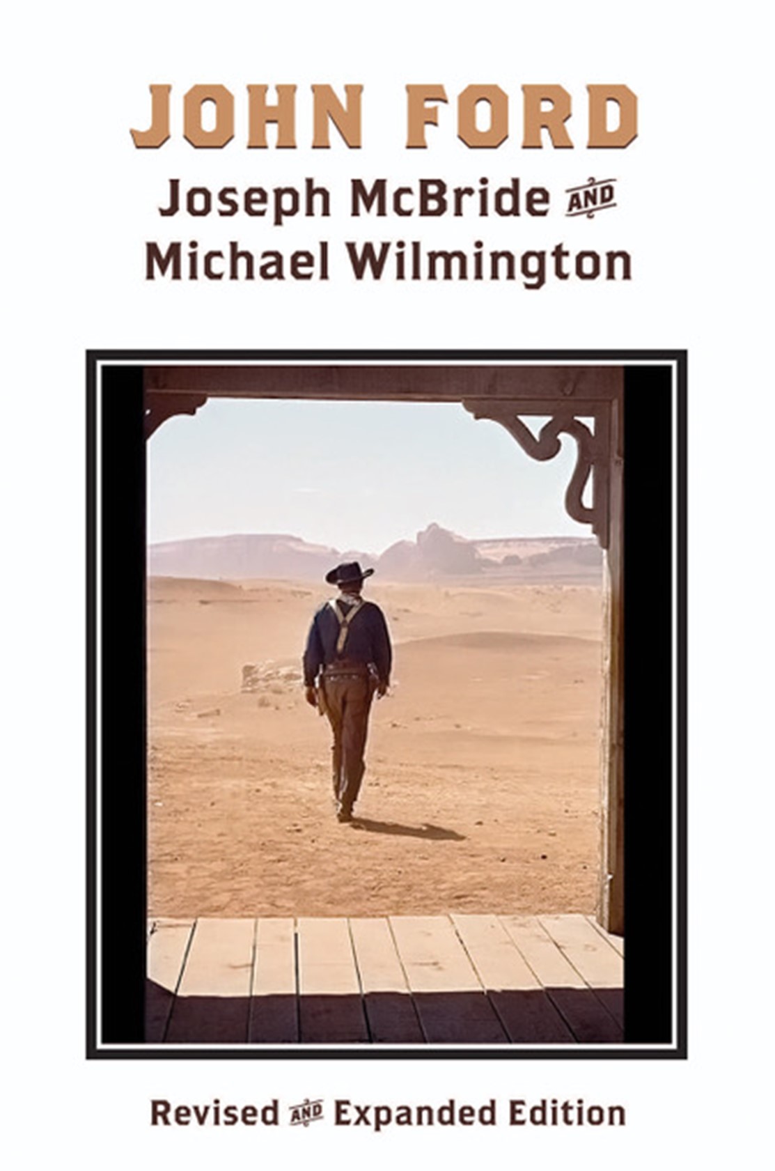 A cowboy walking out of a parlor into the desert