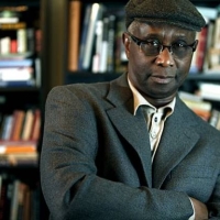 Dr. Jimmy Garrett posing in front of a bookshelf