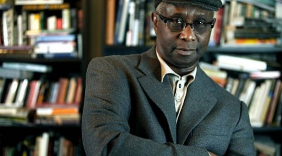 Dr. Jimmy Garrett posing in front of a bookshelf